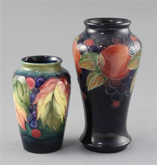 A Moorcroft pomegranate vase and a leaf and berry vase, 1930s, 17.5cm and 12.3cm, first vase with a chip to foot